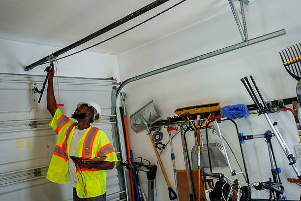 Professional Garage Door Panel Replacement technician working in South Weber, UT